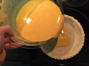Pour filling into pie crust